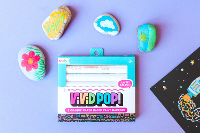 OOLY-Vivid-Pop-Pastel-Paint-Markers-on-a-purple-table-with-painted-rocks.png