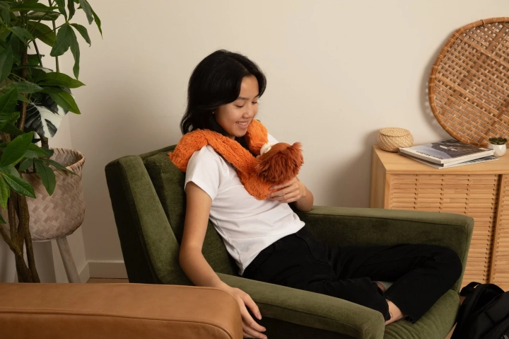 OrangutanTeenChairSmiling.webp