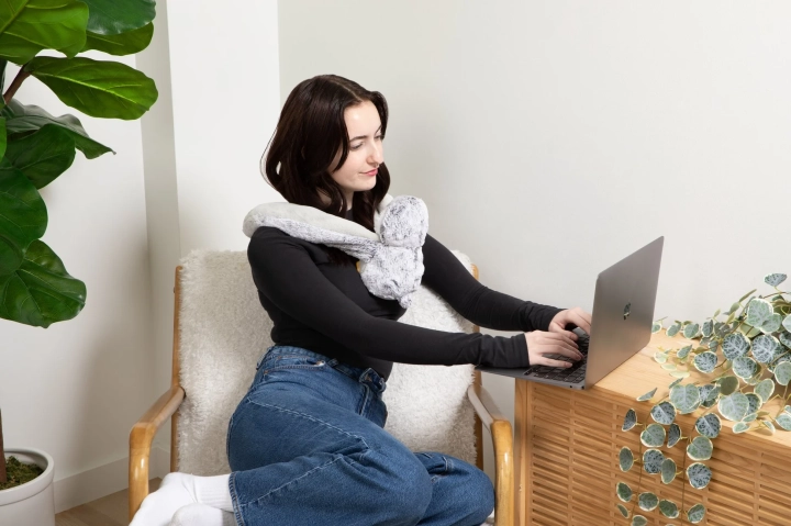 Penguinyoungwomanworkingzoomedout.webp
