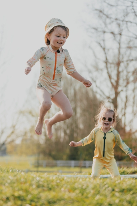 6242d61bf8c63acc3fc0b7c0_Ducksday bucket hat orange palmtree (5).jpg